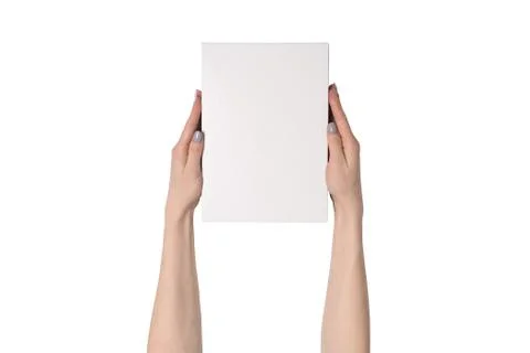 White rectangular box in female hands. Top view. Isolate 스톡 사진