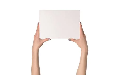 White rectangular box in female hands. Top view. Isolate 스톡 사진