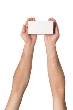 White rectangular box in male hands. Top view. Isolate 스톡 사진