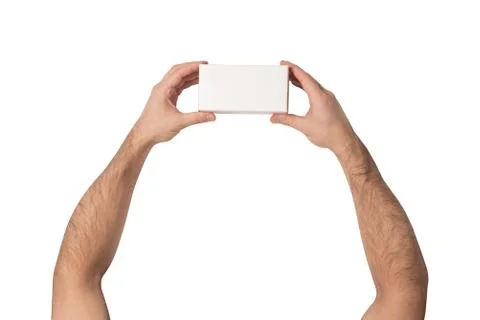 White rectangular box in male hands. Top view. Isolate 스톡 사진
