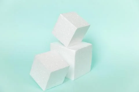 White rectangular cube shapes on blue background. Minimal boxes geometric for Fotos de archivo