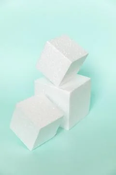 White rectangular cube shapes on blue background. Minimal boxes geometric for Fotos de archivo