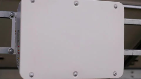 White rectangular device mounted on a metallic rail, showcasing gradual movement Stock Footage 318713146