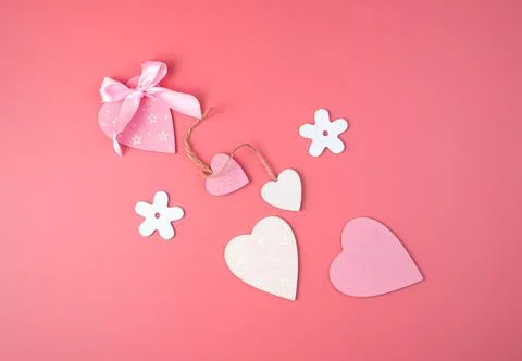 White rectangular frame with a red heart in the center on a pink background. Stock Photos