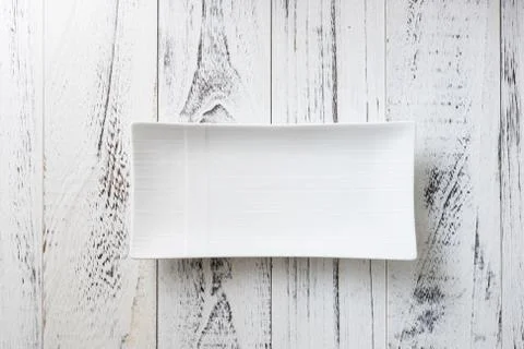 White rectangular Plate on white wooden background Stock Photos