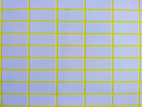 White rectangular price tag stickers on a bright yellow background sheet Foto stock