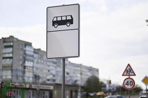 White rectangular road sign shows public transit stop. Stock Photos