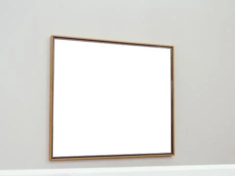 White rectangular surface with brown frames attached to a wall of light gray Stock Photos