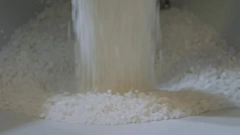 White recycled plastic granules, pellets falling into metal container Stock Footage 341850651