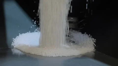 White recycled plastic granules, pellets falling into metal container Stock Footage 344689661