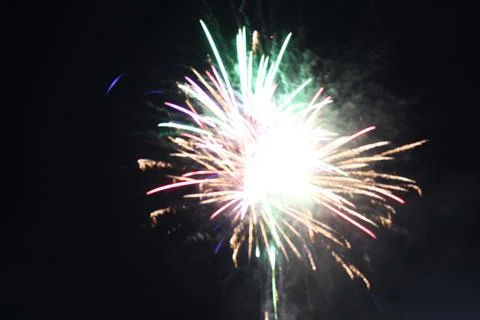 White red flashes rosette fireworks fireworks on a dark background holiday at Stock Photos