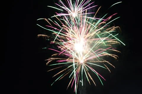 White red flashes rosette fireworks fireworks on a dark background holiday at Stock Photos
