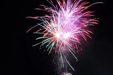 White red flashes rosette fireworks fireworks on a dark background holiday at Stock Photos
