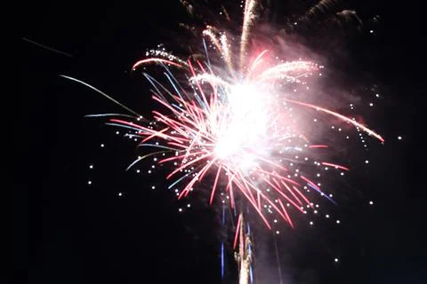 White red flashes rosette fireworks fireworks on a dark background holiday at Stock Photos