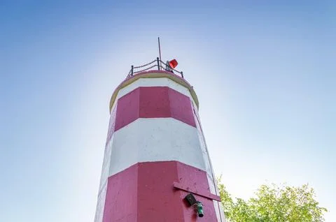 White-Red Lighthouse on the Background a Cloudless Blue Sky Stock Photos