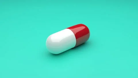 White-Red pills isolated rotating on green background. Video stock 132942748