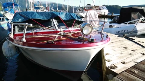 White red small boat tied to dock Stock Footage 58681131