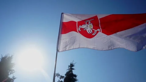 White-red-white flag flies in wind against background of sky. Symbol of Belarusi Stock Footage 138935901