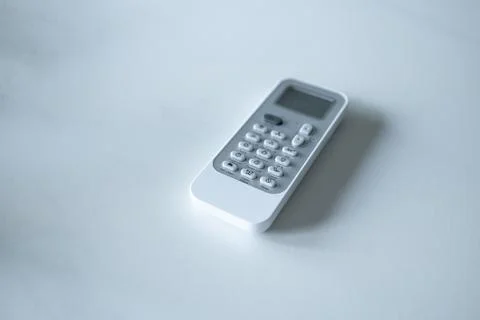 White remote control on a light background top view Stock Photos