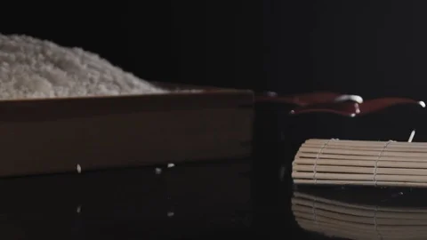 White rice is falling down on the black table. Stock Footage 113031080