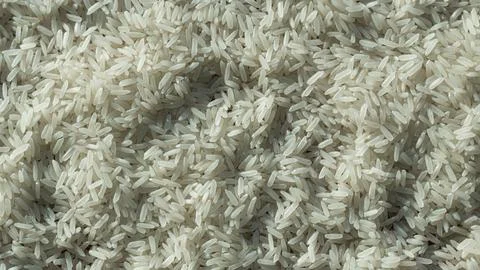 White rice grain texture background. Stock Photos