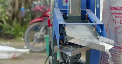 White rice that has gone through the milling process is flowing down.  Stock Footage 278677293