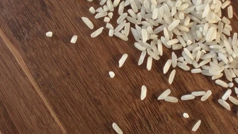White rice heap on the table Видео 79326754