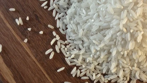 White rice heap on the table Видео 79345182