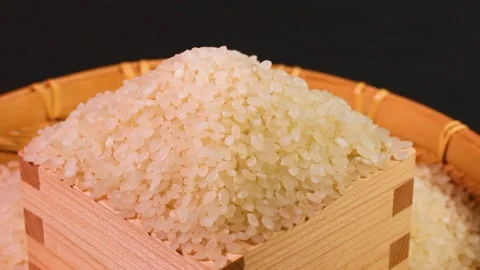 White rice in a measuring cup, rotating Stock Footage 312533264