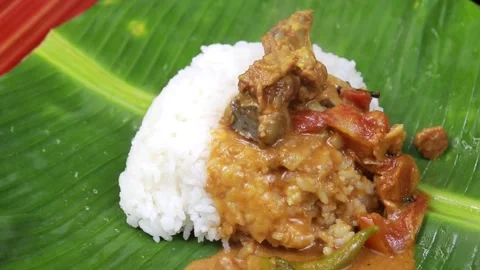 White Rice with Mutton Curry Served on Banana Leaf – South Indian Meal Stock Footage 314411589