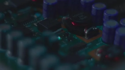 The white ring grows from the printed circuit board with electronic components Stock Footage 313150585