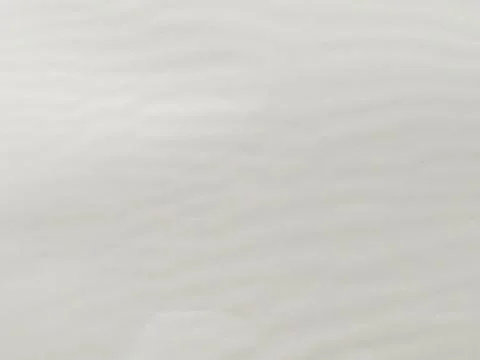 White ripple plastic texture with smooth glossy surface and soft waves Stock Photos