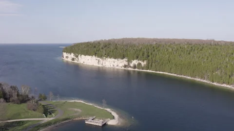 White rock cliffs on a fresh water bay, 4k, slow-mo drone shot Stock Footage 243530598