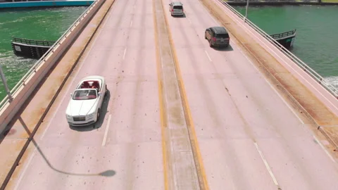 White Rolls Royce Dawn on Bal Harbor Bridge Miami Florida Stock Footage 147231906