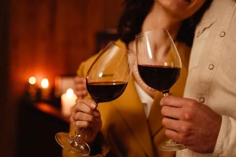 White romantic couple hugging while drinking wine at home Stock Photos