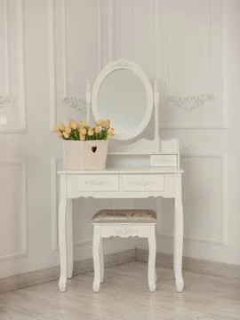White room with mirror, table and chair. Stock Photos