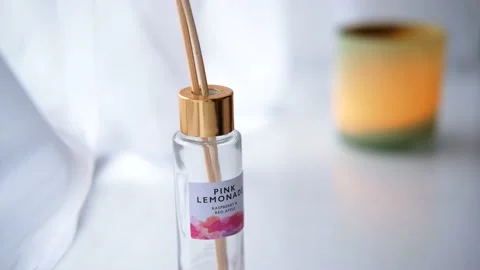 White room of a Spa with a reed diffuser bottle and a green and yellow Stock Footage 138679901