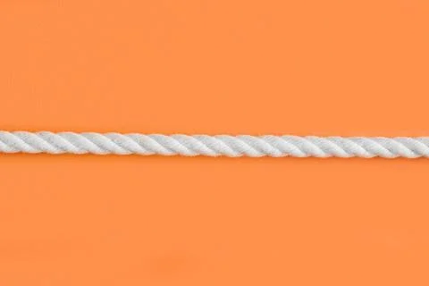 White rope on orange Foto stock