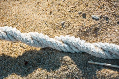White Rope on Sandy Beach Stock Photos