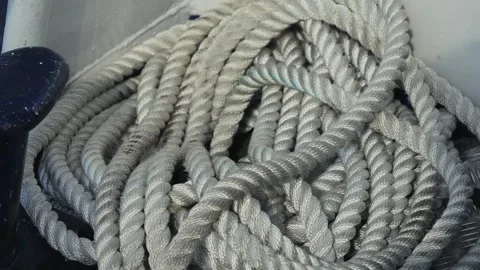 A white rope sprawls across the deck of a boat. Stock Footage 311372968