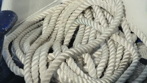 A white rope sprawls across the deck of a boat. Stock Footage 327796829