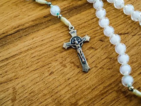 White rosary with Jesus Christ on the cross Stock Photos
