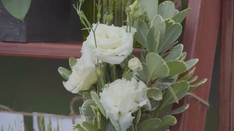 White roses as an element of decor, shooting on the street in the afternoon Stock Footage 103395388