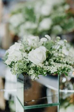 White roses on the wedding table Stock Photos