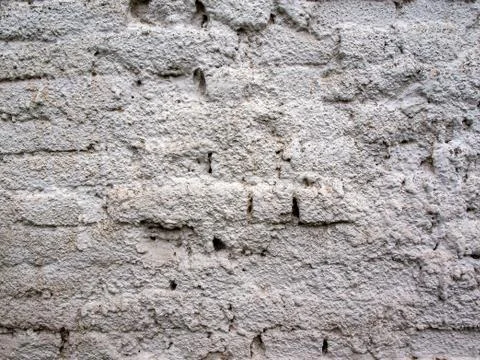 White roughly plastered wall of bricks second photo Stock Photos