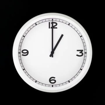 White round analog wall clock isolated on black background. Stock Photos