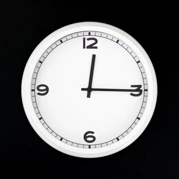 White round analog wall clock isolated on black background. Stock Photos