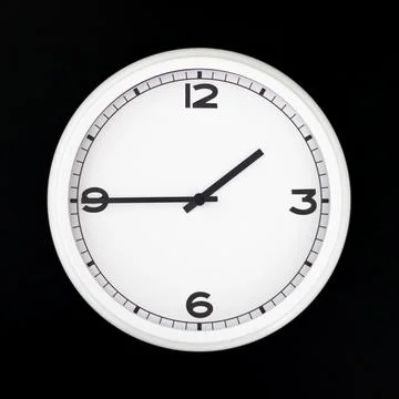 White round analog wall clock isolated on black background. Stock Photos