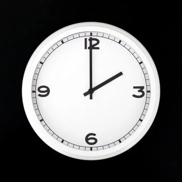 White round analog wall clock isolated on black background. Stock Photos