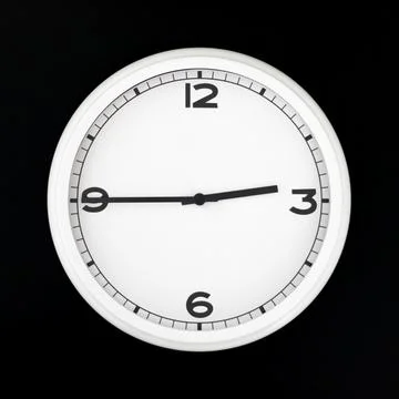 White round analog wall clock isolated on black background. Stock Photos